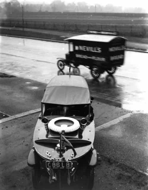 A Peugeot Motorboat Car, seen from above with a van passing behind it, October 1925.