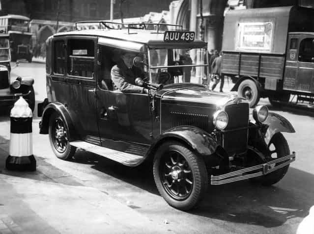 A Morris Commercial taxi-cab and its driver. 11th April 1935.