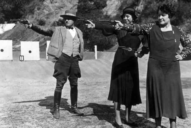 Two women members of the police department in Pasadena, California, showing remarkable aptitude with the revolver under the instruction of Sergeant Bailey, circa 1935. (Photo by General Photographic Agency)