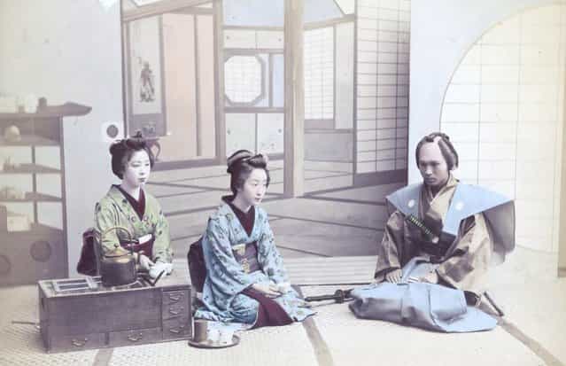 Two geishas receive a visiting samurai, Japan, circa 1880. (Photo by Hulton Archive)