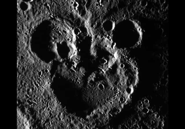 MESSENGER, NASA's spacecraft orbiting Mercury, captured this June 03, 2012 scene near the recently named crater Magritte. Shadowing helps define a striking [Mickey Mouse] resemblance, created by the accumulation of craters over Mercury's long geologic history. (Photo by NASA/Johns Hopkins University Applied Physics Laboratory/Carnegie Institution of Washington)
