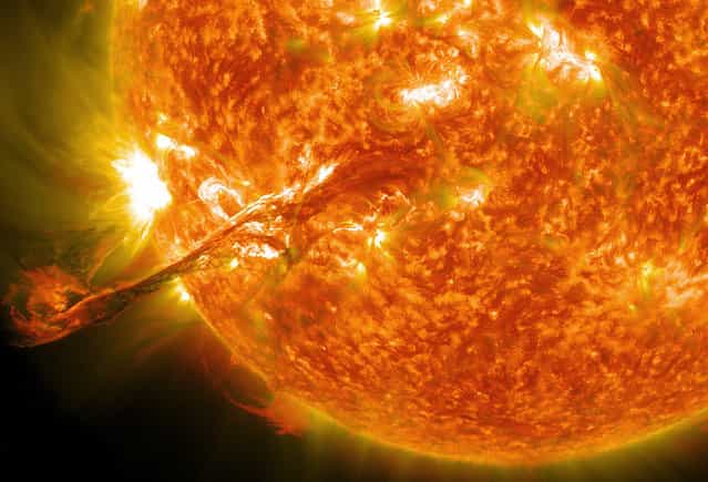 On August 31, 2012, a long filament of solar material that had been hovering in the sun's atmosphere, the corona, erupted out into space at 4:36 p.m. EDT. The coronal mass ejection, or CME, traveled at over 900 miles per second. The CME did not travel directly toward Earth, but did connect with Earth's magnetic environment, or magnetosphere, causing aurora to appear on the night of Monday, September 3. (Photo by NASA/GSFC/SDO)