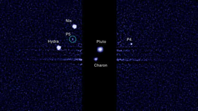 This image, taken by the Hubble Space Telescope, shows the five known moons orbiting the distant, icy dwarf planet Pluto. The green circle marks the newly discovered moon, designated S/2012 (134340) 1, or P5, as photographed by Hubble's Wide Field Camera 3 on 7 July 2012. The moon is estimated to be 10 to 25 kilometers across. It is in a 95,000 kilometer diameter circular orbit around Pluto that is assumed to be aligned in the same plane as the other satellites in the system. The darker stripe in the center of the image is because the picture is constructed from a long exposure designed to capture the comparatively faint satellites of Nix, Hydra, P4 and S/2012 (134340) 1, and a shorter exposure to capture Pluto and Charon, which are much brighter. NASA's New Horizons probe, which will rendezvous with Pluto in July of 2015, was launched in 2006 – back then, Pluto only had three known moons. (Photo by Mr. Showalter/AFP)