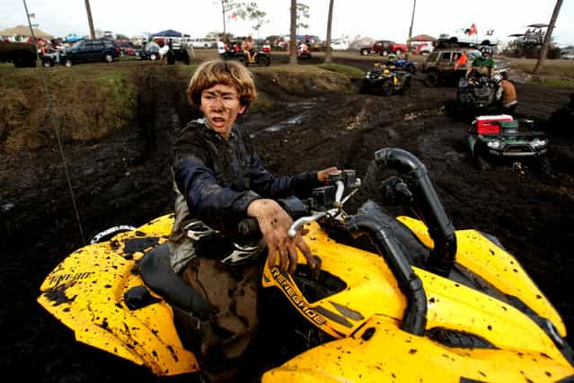 15-year-old Troy Carmen of Merritt Island sits on his ATV. (Photo by Gary Coronado/The Palm Beach Post)