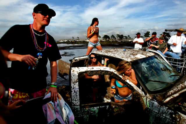 The mud bog is party central throughout the day. (Photo by Gary Coronado/The Palm Beach Post)