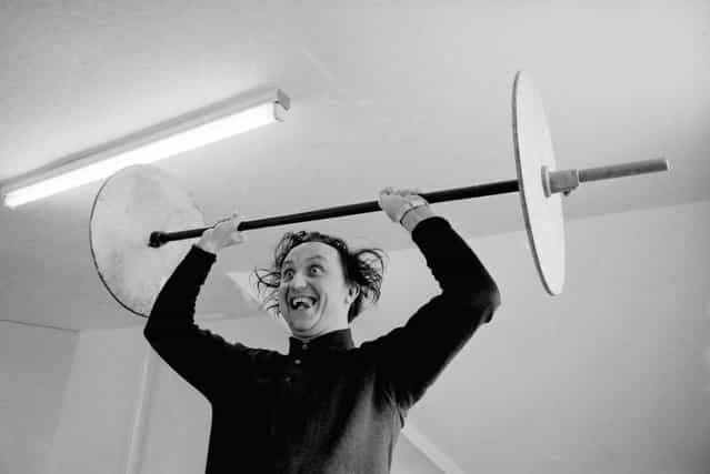 English comedian Ken Dodd lifting weights. 21st April 1966. (Photo by Wood/Express)