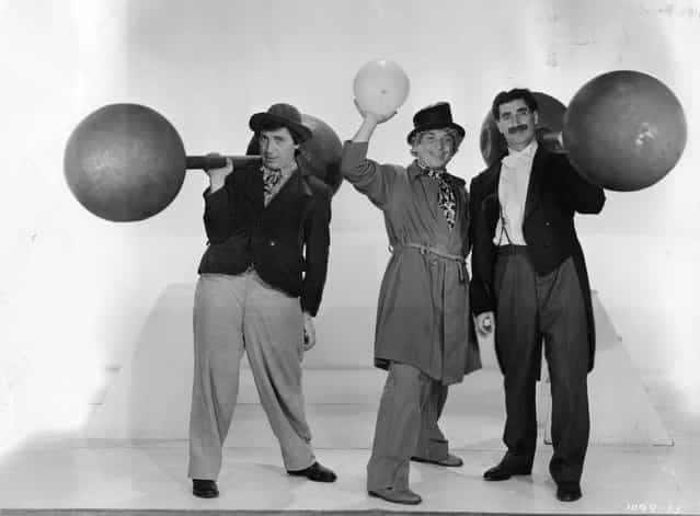 Leonard [Chico] (1887–1961), Adolph [Harpo] (1888–1964) and Julius [Groucho] (1895–1977) Marx in a publicity still from the film [At The Circus] (aka [The Marx Brothers at the Circus]) directed by Edward Buzzell and produced by MGM, 1939. (Photo by Hulton Archive)