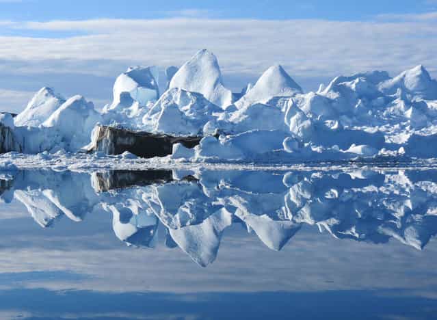 Reflections: Icebergs in the harbor in Ilulissat, Greenland. (Photo by Frank Walley/National Geographic Photo Contest