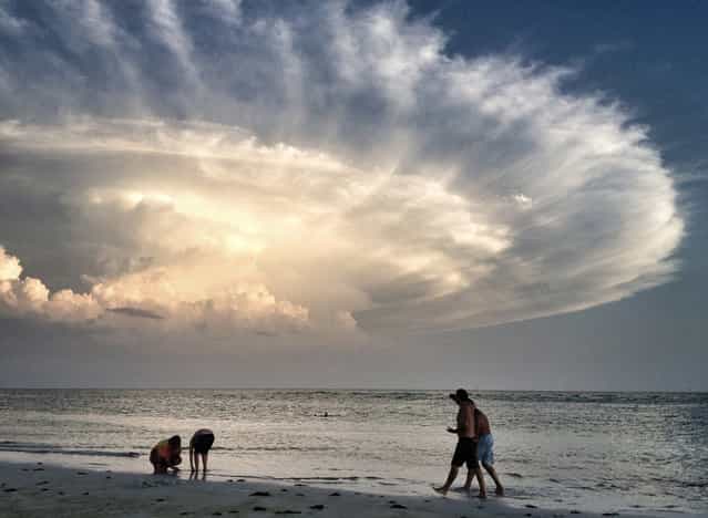 Storm's Backside: Evening stroll on Siesta Key Beach in Sarasota, Florida – voted no. 1 beach in the country. (Photo by Judy Robertson/National Geographic Photo Contest