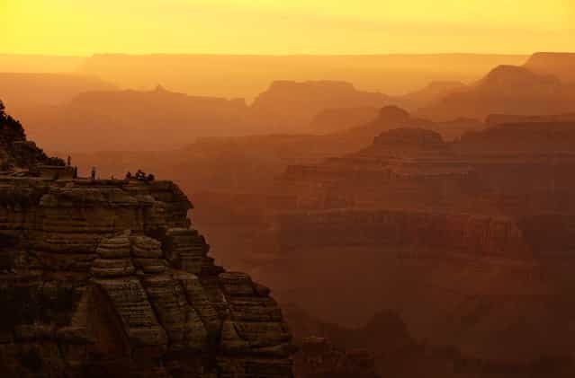 Grand Canyon at Dusk: Grand Canyon visitors watch the sunset from a perch on the south side. (Photo by Phil Hawkins/National Geographic Photo Contest
