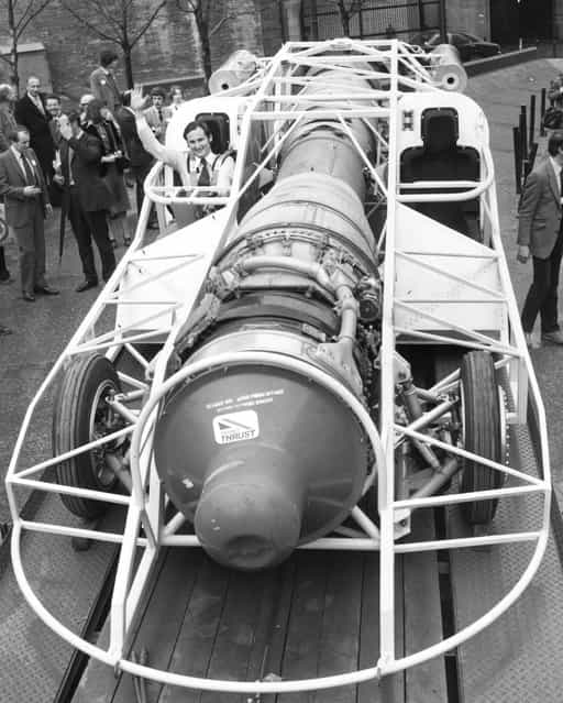 Driver and project leader Richard Noble at Tower Bridge, London, behind the wheel of the 60% complete jet car Thrust 2, in which he hopes to challenge the UK land speed record in the summer of 1980. The car is powered by a Rollys-Royce Avon jet engine, is 27 ft long, weighs 3 tons, has 2700 hp and can accelerate to 600 mph in 23 seconds, with a top speed of 650 mph. 6th December 1979 (Photo by Keystone)