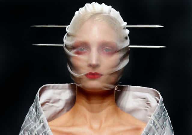A model wears a creation by British fashion designer Gareth Pugh for the fashion house's Spring Summer 2013 ready to wear collection, during Fashion Week in Paris, on September 26, 2012. (Photo by Jacques Brinon/Associated Press)