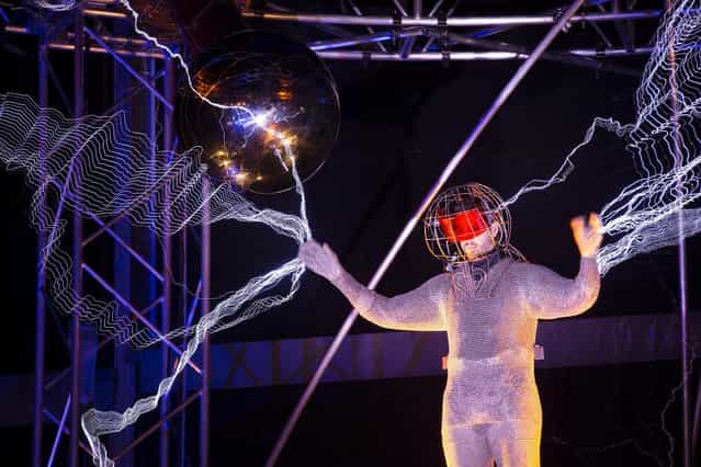 Daredevil stuntman David Blaine lit up New York's Pier 54 on Friday for his latest high voltage feat. The illusionist will spend the next three days and nights standing in the middle of a million volts of electric currents streamed by tesla coils. (Photo by Associated Press)