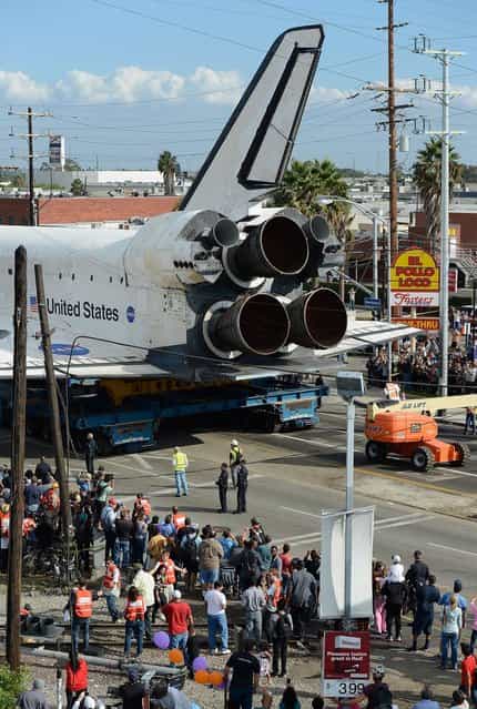 The space shuttle Endeavour is transported to the California Science Center in Exposition Park from Los Angeles International Airport (LAX) on October 12, 2012 in Los Angeles, California. Endeavour was flown cross-country atop NASA's Shuttle Carrier Aircraft from Kennedy Space Center in Florida to LAX on its last flight ever on September 21. From there, it was transported to the California Science Center in Exposition Park where it will be on permanent public display. Completed in 1991, Endeavour was built to replace the space shuttle Challenger which disintegrated during a catastrophic re-entry accident. This fifth and final space shuttle orbiter circled the earth 4,671 times and traveled nearly 123 million miles during its 25 missions from 1992 to 2011. (Photo by Kevork Djansezian)