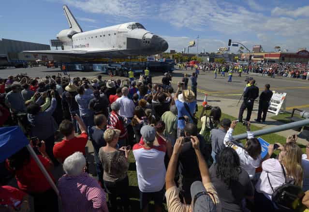 The space shuttle Endeavour is slowly moved along city streets in Los Angeles, California. (Photo by Mark J. Terrill/Reuters)