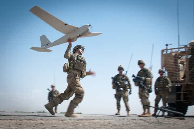 U.S. Army Chief Warrant Officer 2 Dylan Ferguson, a brigade aviation element officer with the 82nd Airborne Division's 1st Brigade Combat Team, launches a Puma unmanned aerial vehicle June 25, 2012, Ghazni Province, Afghanistan. Ferguson uses the Puma for reconnaissance for troops on the ground. (U.S. Army photo by Sgt. Michael J. MacLeod, Task Force 1-82 PAO)