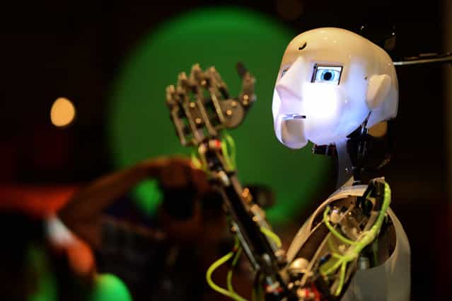 A robot gestures at the Ideen Park fair in Essen, Germany, on August 13, 2012. The fair is organized for children and young adults by the German steel company ThyssenKrupp AG to inspire their spirit of research and to promote careers in science and technology. (Photo by Patrik Stollarz/AFP Photo)