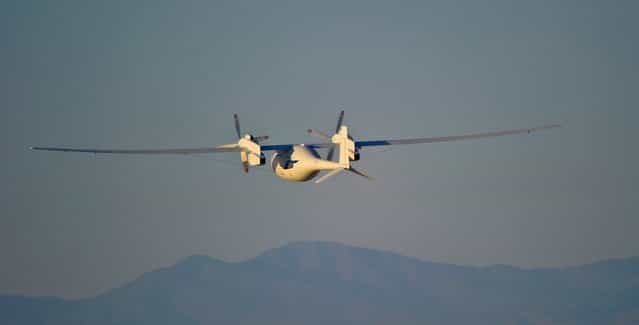 The new Boeing Phantom Eye unmanned drone, designed to stay airborne for days, travels on its first autonomous flight at the NASA Dryden Flight Research Center at Edwards Air Force Base, California, on June 1, 2012. The 28-minute flight began at 6:22 a.m. PDT as the liquid-hydrogen powered aircraft lifted off its launch cart. Phantom Eye climbed to an altitude of 4,080 feet and reached a cruising speed of 62 knots. (Photo by Robert Ferguson/AP Photo/Boeing)