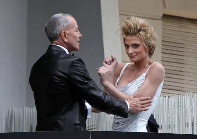 French designer Jean-Claude Jitrois and friend Sarah Marshall attend a photo shoot on a balcony prior to the annual film festival on May 11, 2010 in Cannes, France. (Photo by Sean Gallup)