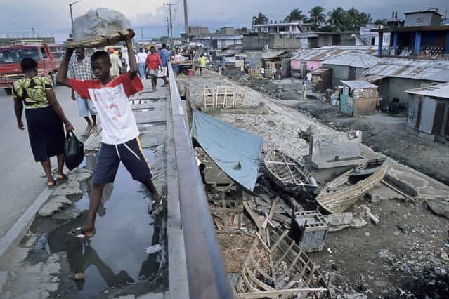 Cap-Haitien, Haiti. On the bridge spanning the Faussette slums in October 2003. (Photo by Jean-Claude Coutausse)