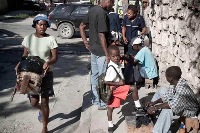 Haiti, Port-Au-Prince. A pupil in the morning in Petion-Ville in November 2003. (Photo by Jean-Claude Coutausse)