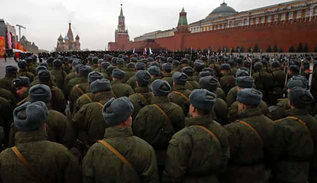 Russian soldiers dressed in Red Army World War II uniforms prepare to march during a rehearsal for a November 7 parade in Moscow's Red Square, November 2, 2012. The parade marks the 71st anniversary of a parade on Red Square when soldiers went directly to the front during World War II. For decades November 7 was a holiday celebrating the 1917 Bolshevik Revolution. (Photo by Misha Japaridze/Associated Press)