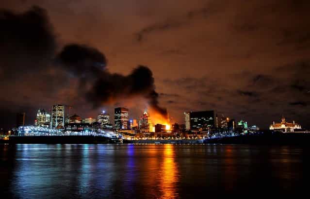 A building burns in Old Montreal, November 8, 2012. (Photo by Evan Kitaljevich/The Canadian Press)