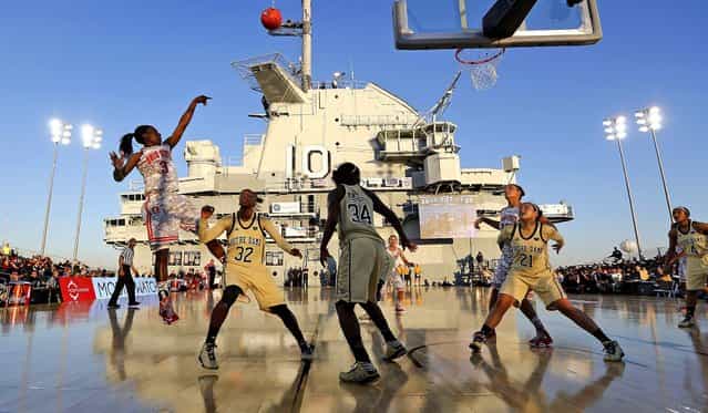 Ohio State's Amber Stokes shoots over Notre Dames's Jewell Loyd during the first half of an NCAA college basketball game in the Carrier Classic, onboard the USS Yorktown in Mount Pleasant, S.C., November 9, 2012 (Photo by Mic Smith/Associated Press)