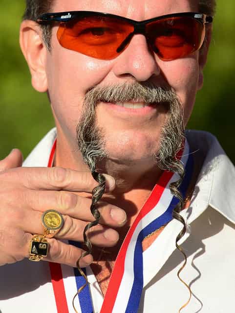 Wojo Wrzesniewski from Toronto, Canada, poses after winning first place in the Fu Manchu Moustache category. (Photo by Frederic J. Brown/AFP Photo)