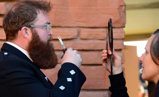 Paddy D. from Los Angeles, California, has a last minute trim ahead of competition at the third annual National Beard and Moustache Championships in Las Vegas, Nevada on November 11, 2012. (Photo by Frederic J. Brown/AFP Photo)