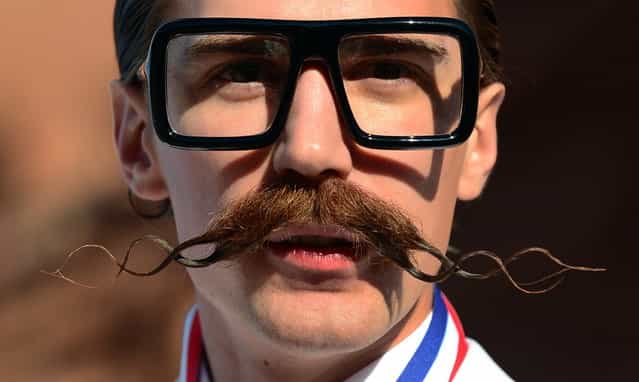 Daniel Lawlor from Los Angeles, California, poses after winning first place in the Freestyle Moustache category at the third annual National Beard and Moustache Championships in Las Vegas, Nevada on November 11, 2012. (Photo by Frederic J. Brown/AFP Photo)