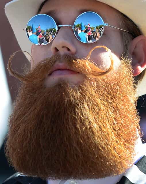 The crowd is reflected in the glasses of a bearded competitor at the third annual National Beard and Moustache Championships in Las Vegas, Nevada on November 11, 2012. (Photo by Frederic J. Brown/AFP Photo)