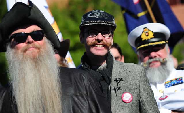 Contestants march in a procession at the opening of the third annual National Beard and Moustache Championships in Las Vegas, Nevada on November 11, 2012. (Photo by Frederic J. Brown/AFP Photo)