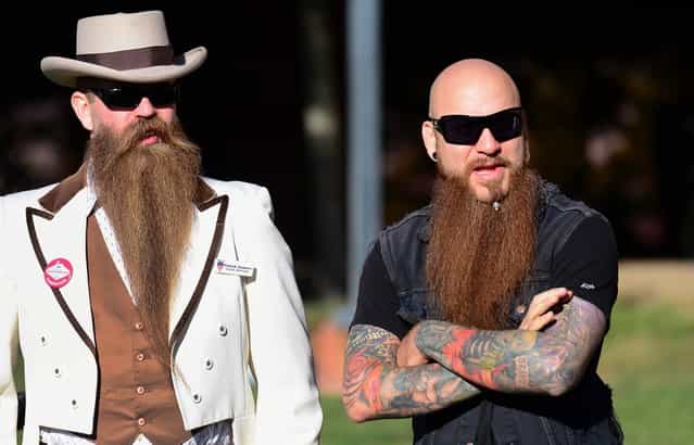 Patrick Dawson (L) from Tacoma, Washington, stands beside a friend while watching the competition at the third annual National Beard and Moustache Championships in Las Vegas, Nevada on November 11, 2012. (Photo by Frederic J. Brown/AFP Photo)
