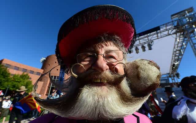 Former World Beard Champion, Gerhard Knapp, from germany, smiles ahead of competition at the third annual National Beard and Moustache Championships in Las Vegas, Nevada on November 11, 2012. (Photo by Frederic J. Brown/AFP Photo)