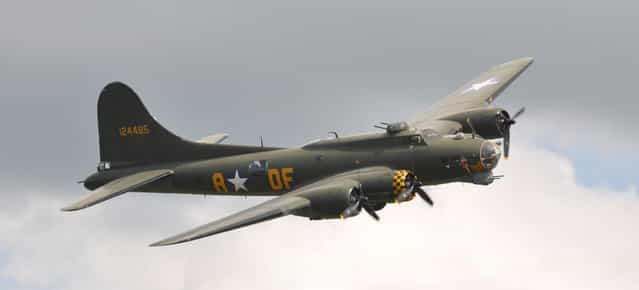 Boeing B-17G Flying Fortress (299P) G-BEDF / 124485/DF-A [Sally B] [Memphis Belle] – Flying Legends Airshow 2012 Duxford. Sally B is the name of an airworthy 1945-built Boeing B-17G Flying Fortress. It was delivered to the United States Army Air Force (USAAF) on 19 June 1945 as 44-85784; after being converted to both a TB-17G and then an EB-17G it was struck off charge in 1954. In 1975 the Institut Géographique National in France bought the plane for use as a survey aircraft. In 1975 it moved to England to be restored to wartime condition as a memorial to the USAAF B-17 airmen who lost their lives in the European theatre. It is based at the Imperial War Museum Duxford, England. The Sally B was used in the film Memphis Belle as one of 5 flying B-17s needed for various film scenes, and it was used to replicate the real Memphis Belle in one scene. Half of the aircraft is still in the Memphis Belle livery. (Rob Lovesey)