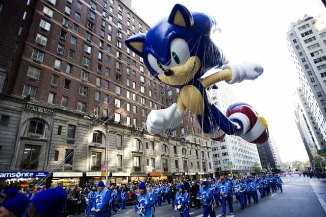 The Sonic the Hedgehog balloon makes its way down Sixth Avenue during the 86th Annual Macy's Thanksgiving Day Parade on November 22, 2012 in New York City. Macy's donated tickets and transportation to this year's Thanksgiving Day Parade to 5,000 people from neighborhoods hardest hit by Superstorm Sandy. (Photo by Charles Sykes/Associated Press)