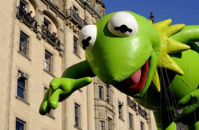 The Kermit The Frog balloon makes its way down New York's Central Park West. (Photo by Louis Lanzano/Associated Press)