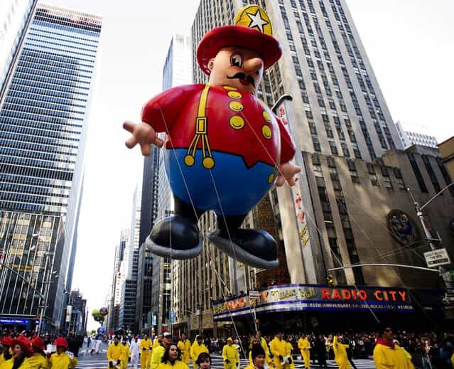 The Harold the Fireman balloon floats in the Macy's Thanksgiving Day Parade in New York. (Photo by Charles Sykes/Associated Press)