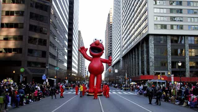 The Elmo balloon makes it's way down J.F.K. Boulevard during the 93rd annual Thanksgiving Day parade in Philadelphia. (Photo by Joseph Kaczmarek/Associated Press)