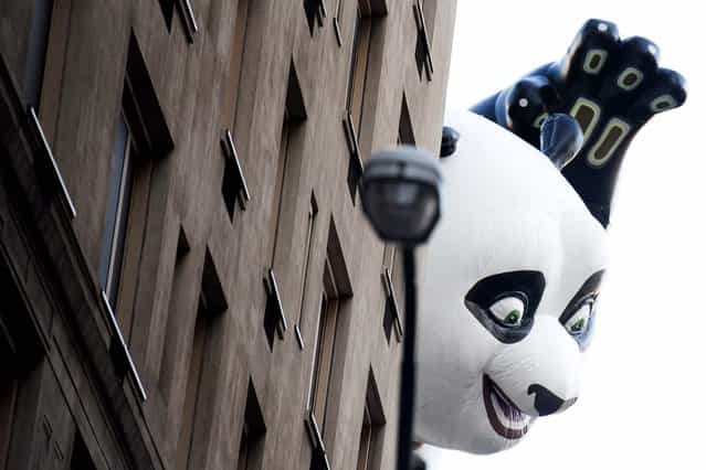 The Kung Fu Panda balloon floats in the Macy's Thanksgiving Day Parade in New York. (Photo by Charles Sykes/Associated Press)