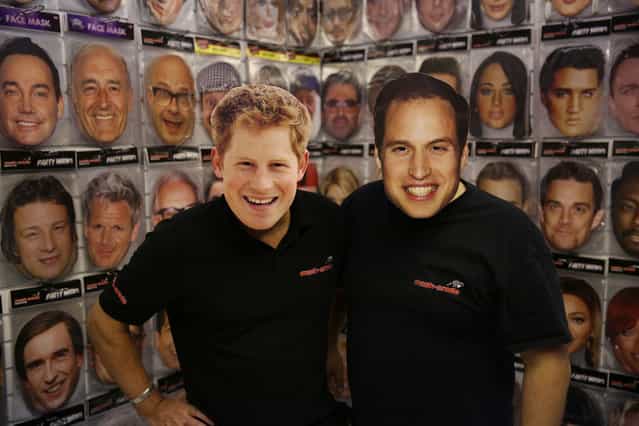 Salesman wear Prince Harry and Prince William masks at The Ideal Home Christmas Show in London, England, November 14, 2012. Over 400 exhibitors are showcasing a range of gift ideas for Christmas at the Earls Court exhibition centre. (Photo by Peter Macdiarmid)