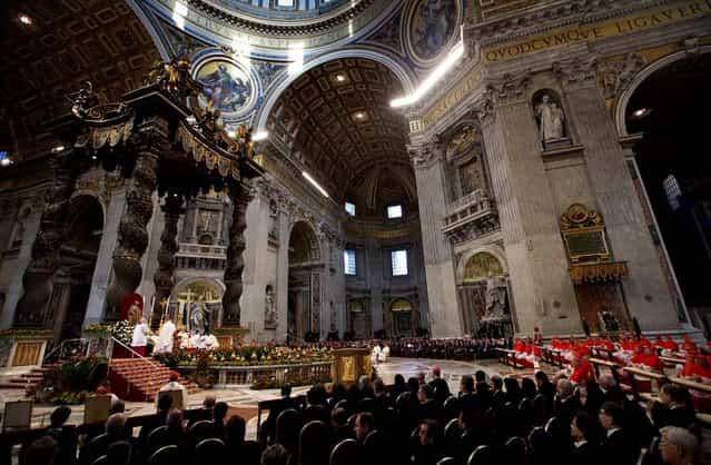 Pope Benedict XVI celebrates a mass for newly elected cardinals in St. Peter's Basilica at the Vatican, November 25, 2012. The pontiff elevated six new cardinals to the elite club of churchmen who will elect his successor, bringing a more geographically diverse mix into the European-dominated College of Cardinals. (Photo by Andrew Medichini/Associated Press)