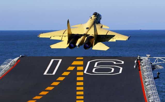 In this undated photo released by China's Xinhua News Agency, made available on Sunday a carrier-borne J-15 fighter jet takes off from China's first aircraft carrier, the Liaoning. China has successfully landed a fighter jet on its first aircraft carrier, which entered service two months ago, the country's official news agency confirmed Sunday. (Photo by Zha Chunming/Xinhua)