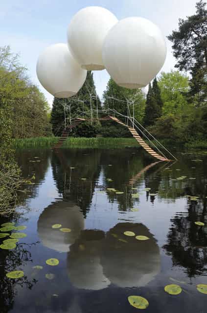French artist Olivier Grossetête used three enormous helium balloons to float a rope bridge over a lake in Tatton Park, a historic estate in north-west England. Though visitors w

<div class=