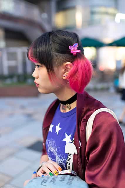 Pink Hair & Butterfly in Harajuku. A friendly Japanese girl with a pink & black hairstyle & pink butterfly hair clips snapped in Harajuku. (Tokyo Fashion)