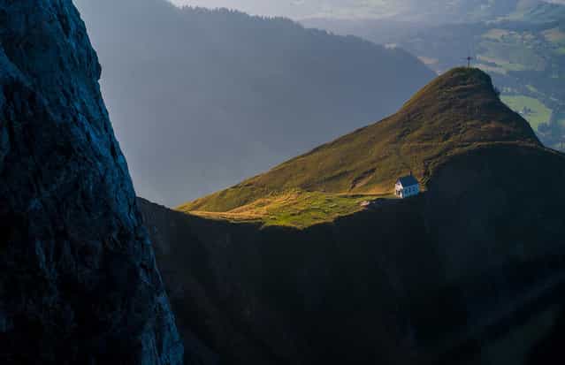 [Chapel on Klimsenhorn: I took this picture while I was in an aerial cableway going down from the Mt. Pilatus in Central Switzerland. It was the end of a nice day spent hiking, including a stop by the beautiful little white chapel on Klimsenhorn on the way to the top]. (Photo and comment by Agne Subelyte/National Geographic Photo Contest via The Atlantic)