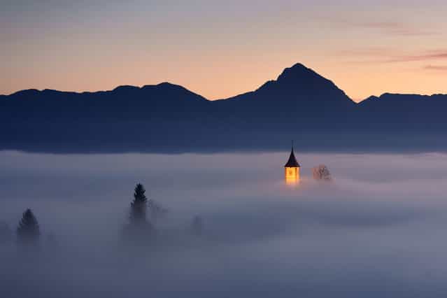 [Piece of Heaven: Jamnik, small village in Slovenia. One morning in in autumn, fog was just at the right height at the right time. The atmosphere was heavenly, unforgettable]. (Photo and comment by Janez Tolar/National Geographic Photo Contest via The Atlantic)