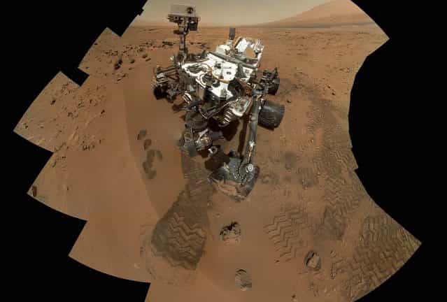 This image shows the work site of the NASA rover Curiosity on Mars, December 3, 2012. Results are in from the first test of Martian soil by the rover Curiosity: So far, there is no definitive evidence that the red planet has the chemical ingredients to support life. Scientists said that a scoop of sandy soil analyzed by the rover's chemistry lab contained water and a mix of chemicals, but not the complex carbon-based compounds considered necessary for microbial life. (Photo by NASA)