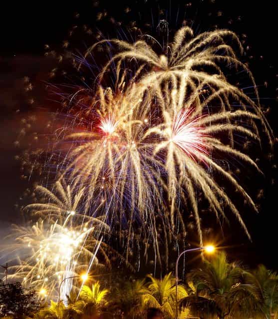 Fireworks light up the sky at Manila Bay in Manila, Philippines. (Photo by Bullit Marquez/Associated Press)